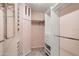 Organized walk-in closet with shelving and hanging rods at 102 Underbrush Trl, Port Orange, FL 32128