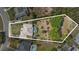 Aerial shot of a home with a pool and expansive yard backing up to mature trees at 1058 W Seagate Dr, Deltona, FL 32725