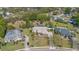 Aerial view of home with large yard, pool, and mature trees at 1058 W Seagate Dr, Deltona, FL 32725