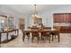 Cozy dining room with wood furniture, lots of sunlight and tile floors at 1058 W Seagate Dr, Deltona, FL 32725