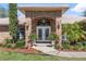 Charming brick home featuring a double door entrance and beautifully landscaped front yard at 1058 W Seagate Dr, Deltona, FL 32725