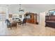 Bright living room with travertine floors, custom entertainment center, and traditional furnishings at 1058 W Seagate Dr, Deltona, FL 32725