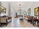 Spacious living room with travertine floors, neutral walls, and a view of the front entrance at 1058 W Seagate Dr, Deltona, FL 32725