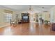 Open-concept living area with hardwood floors, stylish furniture, and a TV entertainment center at 1058 W Seagate Dr, Deltona, FL 32725
