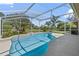 Sparkling screened in pool, perfect for outdoor enjoyment and relaxation with landscaped surroundings at 1058 W Seagate Dr, Deltona, FL 32725
