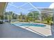A crystal clear pool is enclosed by a screen to keep leaves and pests out at 1058 W Seagate Dr, Deltona, FL 32725