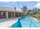 Screened in pool with brick home, spacious patio area with fans for entertaining at 1058 W Seagate Dr, Deltona, FL 32725