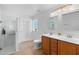 Bright bathroom with double sink vanity, glass shower, tile floors, and bright lighting at 1062 Golf View Estates Dr, Orange City, FL 32763