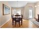 Dining area with chandelier and front door view at 1062 Golf View Estates Dr, Orange City, FL 32763