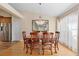 Dining area showcases wooden table under a chandelier, connecting seamlessly with the kitchen at 1062 Golf View Estates Dr, Orange City, FL 32763