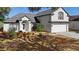 Charming home featuring manicured landscaping and an arched entryway, offering an inviting curb appeal at 1062 Golf View Estates Dr, Orange City, FL 32763
