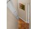 Tiled hallway with decorative artwork and hanging sconces at 1062 Golf View Estates Dr, Orange City, FL 32763
