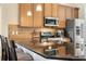 Stainless steel appliances and granite countertops in this lovely kitchen at 1062 Golf View Estates Dr, Orange City, FL 32763