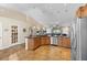 Spacious kitchen with a breakfast bar, stainless steel appliances, tile backsplash and open floor plan at 1062 Golf View Estates Dr, Orange City, FL 32763