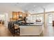Kitchen featuring dark granite countertops, breakfast bar, pendant lighting, and tile floors at 1062 Golf View Estates Dr, Orange City, FL 32763