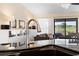 Modern kitchen with stainless steel faucet and granite countertops offering views to the living room at 1062 Golf View Estates Dr, Orange City, FL 32763