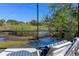 Enjoy picturesque water views from this lovely lanai with lounge chairs, offering peaceful relaxation at 1062 Golf View Estates Dr, Orange City, FL 32763