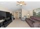 Bright open-concept living room with vaulted ceiling, comfortable seating, and natural light at 1062 Golf View Estates Dr, Orange City, FL 32763