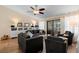 Spacious living room boasts neutral colors, tile floors, and a ceiling fan for added comfort at 1062 Golf View Estates Dr, Orange City, FL 32763