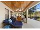 Relaxing patio with multiple seating options and a view of the water at 1062 Golf View Estates Dr, Orange City, FL 32763
