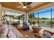 Inviting outdoor patio with seating, a dining table, fire pit and a view of the water at 1062 Golf View Estates Dr, Orange City, FL 32763