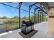 Outdoor patio with a grill overlooking a beautiful pond at 1062 Golf View Estates Dr, Orange City, FL 32763