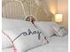 Close up of decorative pillows on a queen size bed, featuring decorative script at 1062 Golf View Estates Dr, Orange City, FL 32763