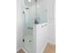 Bright frameless shower with handheld shower and built in shelving at 1062 Golf View Estates Dr, Orange City, FL 32763