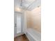 Bathroom with a shower tub, shower rod and partial glass enclosure door at 1062 Golf View Estates Dr, Orange City, FL 32763