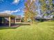 Beautiful backyard with lush green grass and a privacy fence, perfect for outdoor activities and relaxation at 107 Gladesdown Ct, Deland, FL 32724
