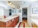 Bathroom featuring double sinks and access to the bathtub and bedroom at 107 Gladesdown Ct, Deland, FL 32724