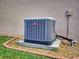 Exterior view of the home's air conditioning unit and landscape at 107 Gladesdown Ct, Deland, FL 32724