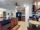 Open kitchen with stainless steel appliances, dark granite countertops, and ample cabinet space at 107 Gladesdown Ct, Deland, FL 32724