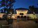 Outdoor bar with string lights creates a cozy backyard space for entertaining friends and Gathering at 1088 Happy Forest Loop, Deland, FL 32720