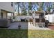 A well-maintained backyard featuring an outdoor kitchen, grill, and plenty of space for entertaining guests at 1088 Happy Forest Loop, Deland, FL 32720