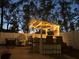 This outdoor bar is perfect for evening entertaining, with string lights and a built in TV at 1088 Happy Forest Loop, Deland, FL 32720