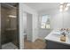 Modern bathroom with a glass-enclosed shower and double sink vanity at 1088 Happy Forest Loop, Deland, FL 32720