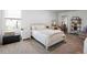 Inviting bedroom with neutral color scheme and comfy furniture at 1088 Happy Forest Loop, Deland, FL 32720