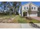 A home with landscaping, a driveway, and a two car garage at 1088 Happy Forest Loop, Deland, FL 32720