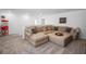 Upstairs living room with large sectional sofa, plush carpet, and a decorative popcorn machine at 1088 Happy Forest Loop, Deland, FL 32720