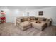Spacious living area with a large sectional sofa, providing ample seating and a cozy atmosphere at 1088 Happy Forest Loop, Deland, FL 32720