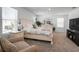 Bright main bedroom featuring a large bed, neutral tones, and ample natural light at 1088 Happy Forest Loop, Deland, FL 32720