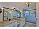 Modern bathroom featuring dual sinks, granite countertops, and a glass-enclosed shower at 111 Brown Crane Ct, Daytona Beach, FL 32119