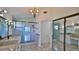 Bathroom featuring dual sinks, granite countertops, and glass-enclosed shower at 111 Brown Crane Ct, Daytona Beach, FL 32119