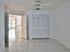 This bright bedroom features tiled flooring, ceiling fan, and closet space at 111 Brown Crane Ct, Daytona Beach, FL 32119
