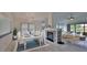 Bright dining room with elegant chandelier, fireplace, and seamless flow to the living area at 111 Brown Crane Ct, Daytona Beach, FL 32119