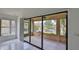 Screened patio featuring a beautiful lake view, ceiling fan and access to the interior space at 111 Brown Crane Ct, Daytona Beach, FL 32119