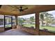 Inviting screened patio overlooking the water offers a fan and peaceful views at 111 Brown Crane Ct, Daytona Beach, FL 32119
