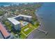 Aerial shot of a condo by the water, with a swimming pool, shuffleboard court, and nearby parking at 1224 S Peninsula Dr # 210, Daytona Beach, FL 32118