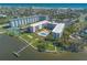 Aerial view of a waterfront condo community featuring a pool, manicured lawns, and convenient water access at 1224 S Peninsula Dr # 210, Daytona Beach, FL 32118
